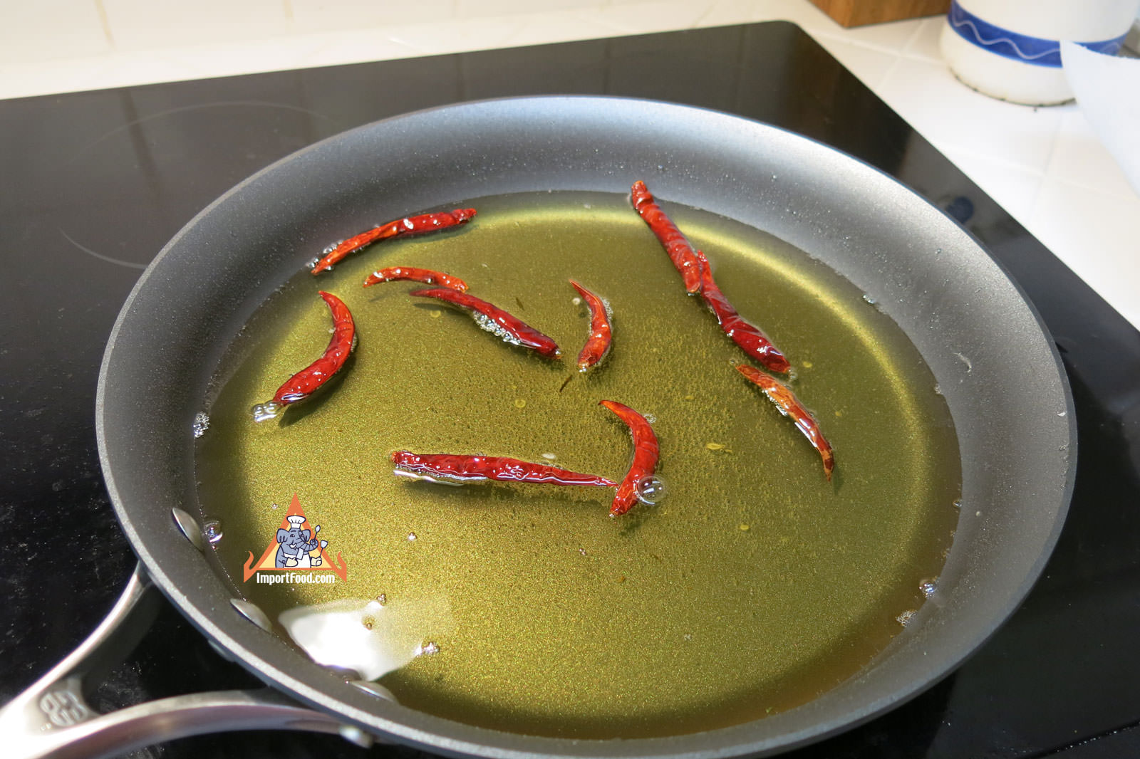 Fry whole dried chiles for garnish