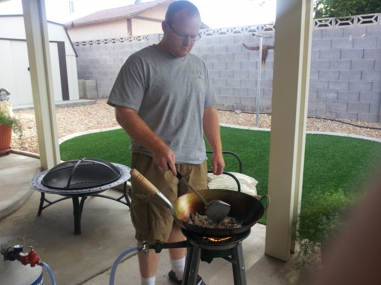 Grandson learning the way of the wok