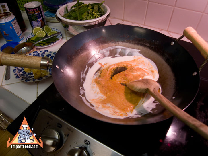 Add kaeng kua to boiling coconut milk