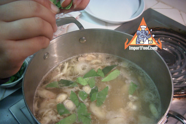 Adding kaffir lime leaves