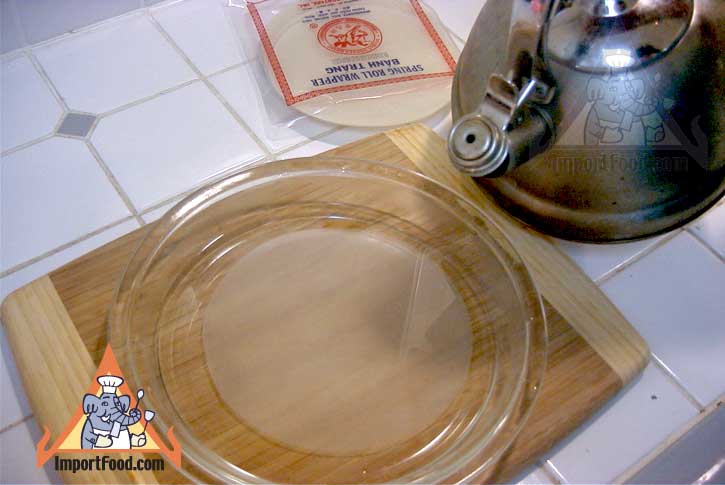 Warm water into pan with rice paper