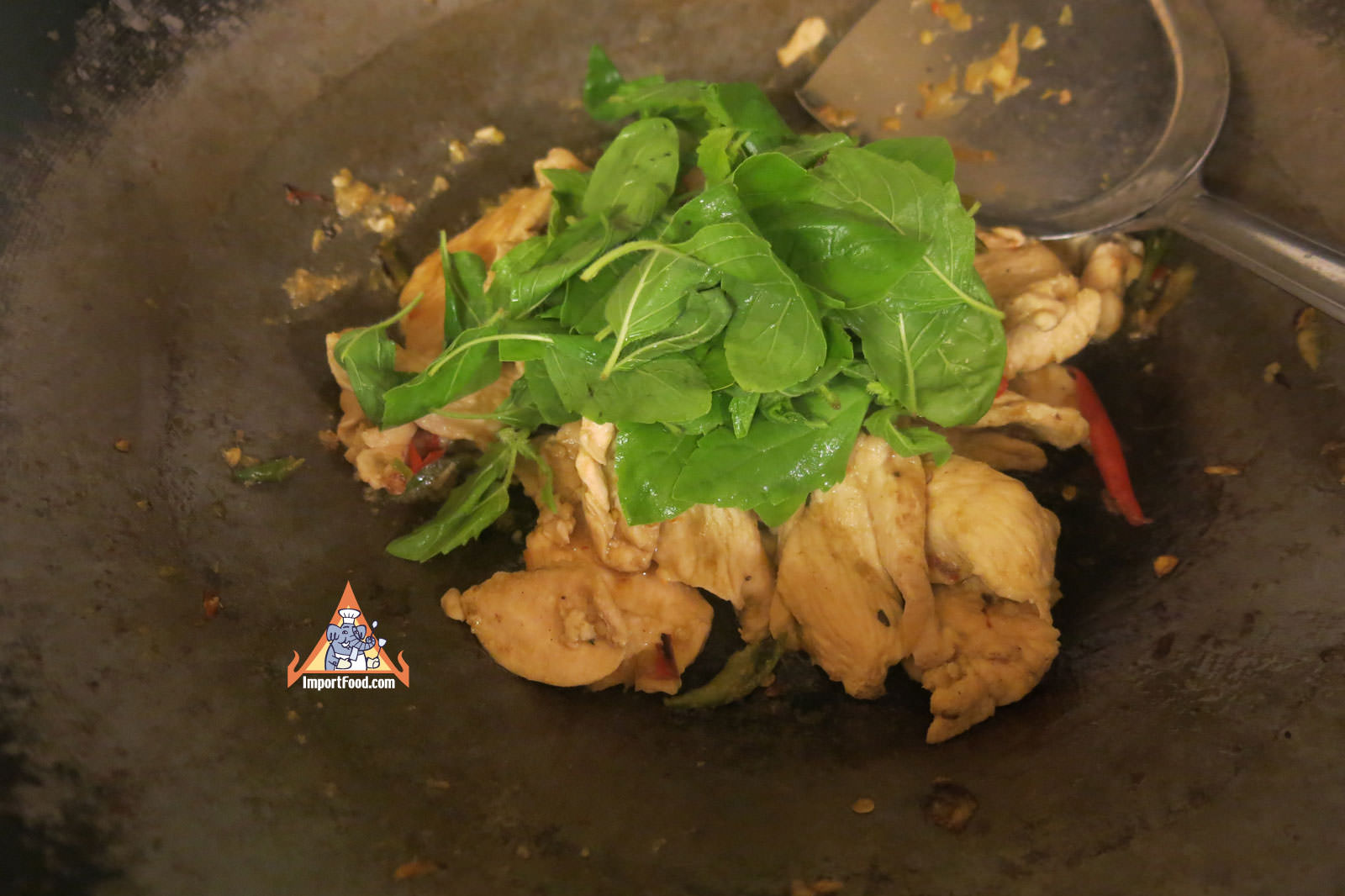 Add fresh krapao basil