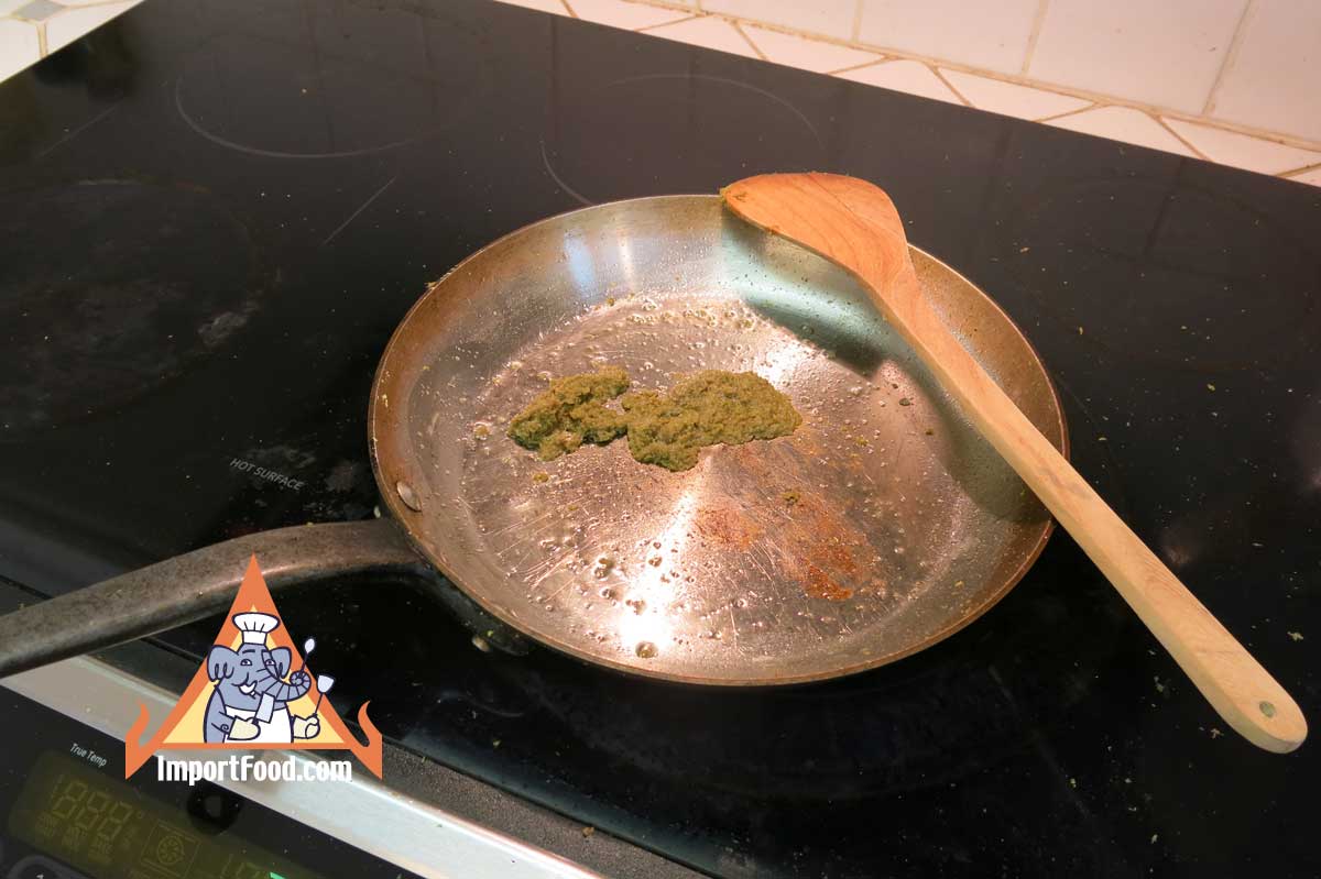 Fry green curry paste until fragrant