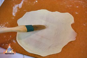 Flatten again and brush with oil