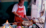 Thai Street Vendor Offers Khao Mun Gai from a Shophouse Cart