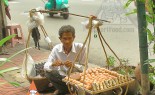 Thai Street Vendor Offers Sticky Rice Wrapped in Banana Leaves, Kao Neeo Khai Ping