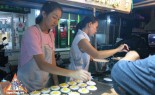 Thai Street Vendor Prepares Thai-Style Pancakes, Khanom Buang