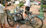 Thai Street Vendor prepares Barbecue Pork, Chicken and Beef Skewers