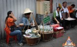 Thai Street Vendor hand wrapping Miang Kahm
